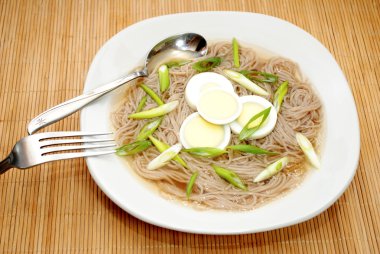 Oriental Egg and Noodle Soup Served in a Bowl clipart