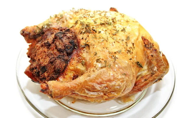 Whole Roasted Chicken with Bread Dressing on a Glass Plate — Stock Photo, Image