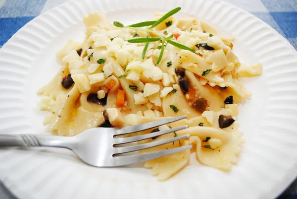 Eating Asiago Cheese on a Bowtie Pasta — Stock Photo, Image