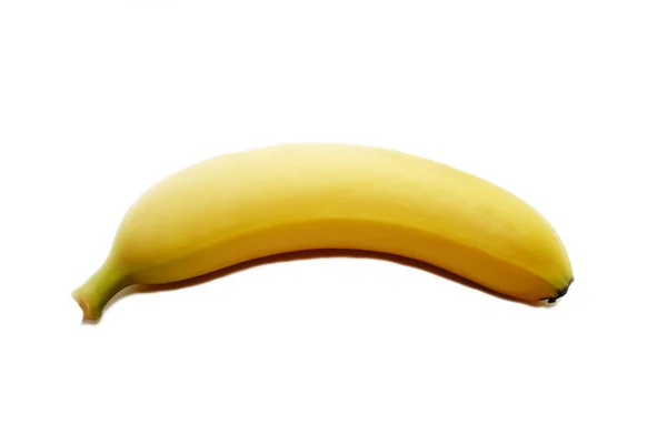 Une banane jaune isolée sur un fond blanc — Photo
