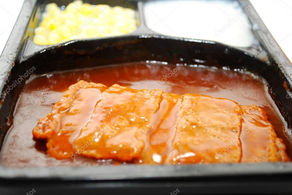 TV Dinner with Focus on a BBQ Boneless Pork Patty