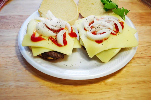Two Plated Cheeseburgers Catsup Sliced Onions — Stock Photo, Image