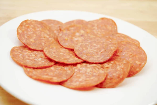 Sliced Pepperoni Heaped White Bowl — Stock Photo, Image