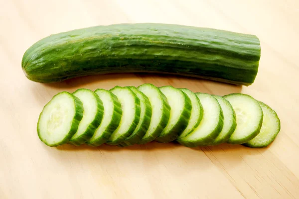 Whole Sliced Cucumbers Wooden Cutting Board — Stock Photo, Image