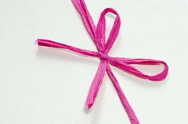 Pink bow on white background — Stock Photo, Image