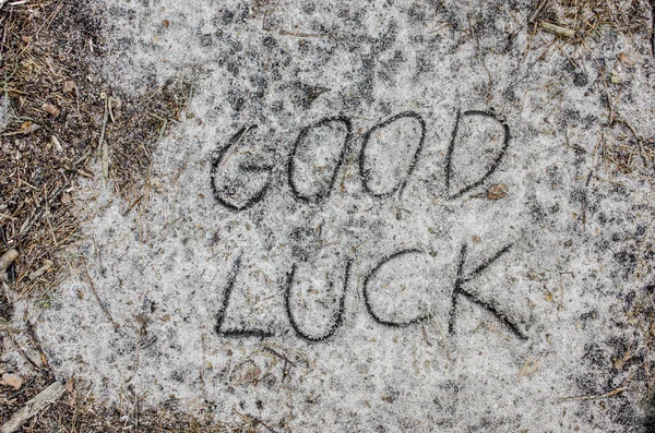 Good luck inscription  on sand — Stock Photo, Image