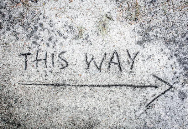 This way inscription  on sand — Stock Photo, Image