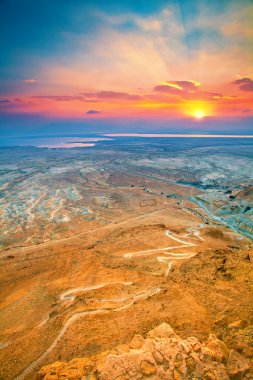 Beautiful sunrise over Masada fortress clipart