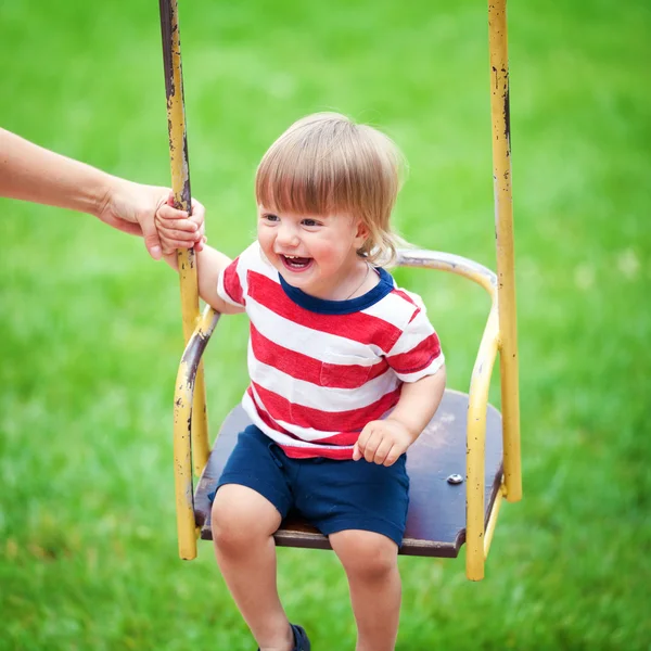 Boy on  swing — Stock Photo, Image