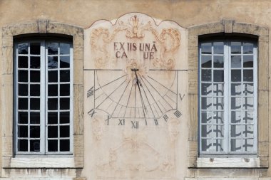 The sundial at the Cluny abbey clipart