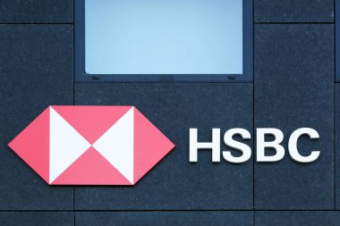 Lyon, France - May 21, 2020: HSBC logo on a wall. HSBC Holdings is a British multinational banking and financial services company headquartered in London, United Kingdom clipart