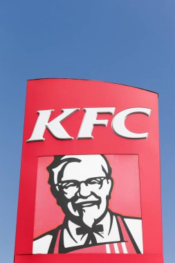 Grenoble, France - June 24, 2017: KFC logo on a panel. KFC is a fast food restaurant chain that specializes in fried chicken and is headquartered in Louisville, Kentucky, in the United States