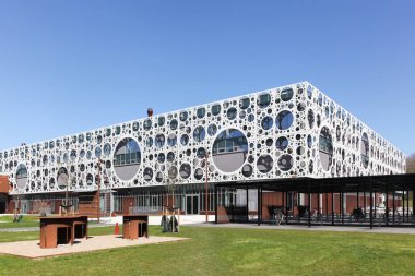 Odense, Denmark - April 9, 2017: Odense University building. University of Southern Denmark is a university and campus in Odense, Denmark built by CF Moller architects clipart