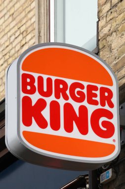 Aarhus, Denmark - March 4, 2022: Burger King logo on a wall. Burger King is a global chain of hamburger fast food restaurants