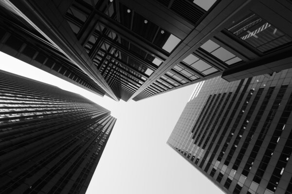 Black and white abstract upward view of downtown skyscrapers.