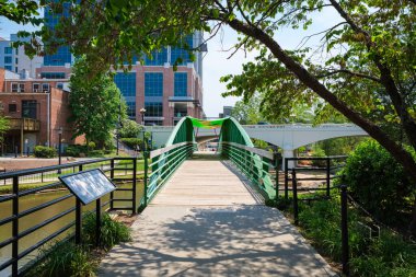 Greenville, South Carolina USA - May 4, 2022: Downtown cityscape view of Falls Park at the Reedy in this charming southern town.
