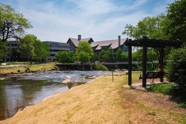 Greenville, South Carolina USA - May 4, 2022: Downtown cityscape view of Falls Park on the Reedy in this charming southern town.
