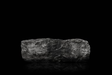 Stone podium on dark black background.	