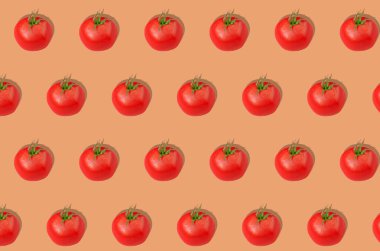 Pattern. Red tomatoes on an orange background. Concept of healthy eating. Horizontal orientation.