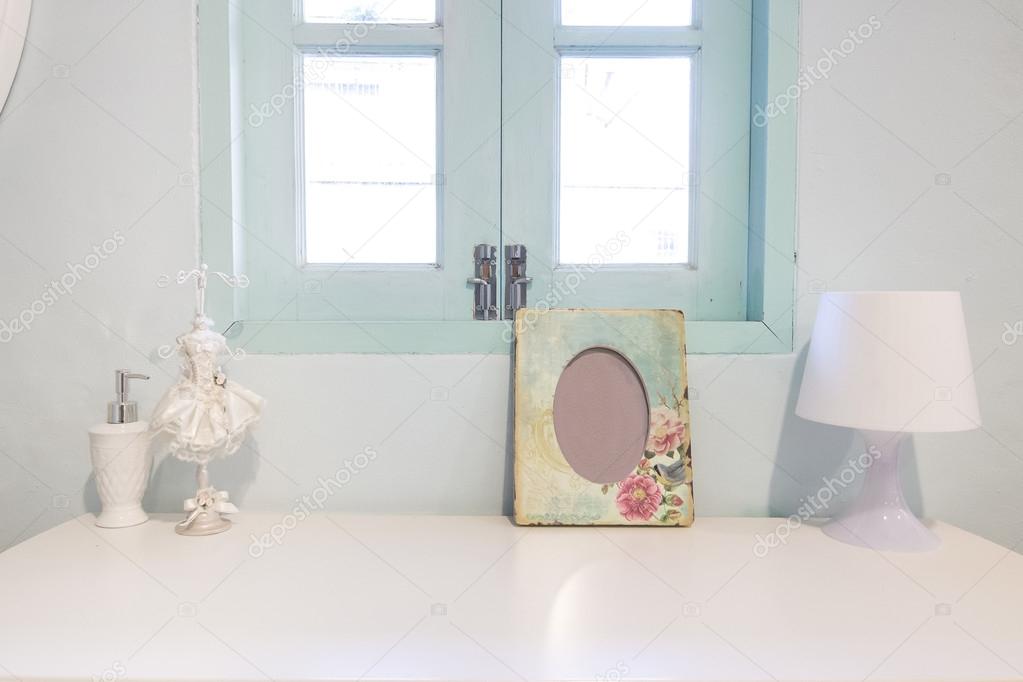 Picture flame , lamp and perfume Bottle on wooden vanity table