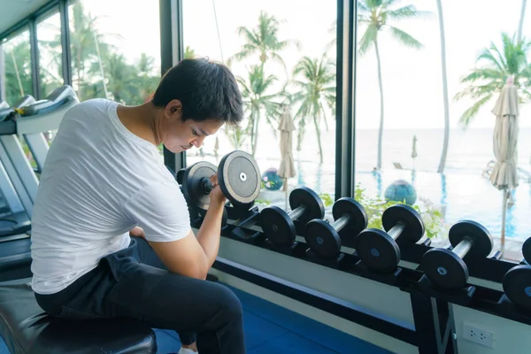 Asian Man Working Out Dumbbell Weight Training Resort Fitness Center — Fotografia de Stock