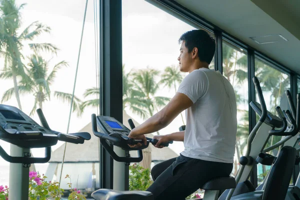 Asian Man Working Out Indoor Cycling Resort Fitness Center Morning — Stok fotoğraf