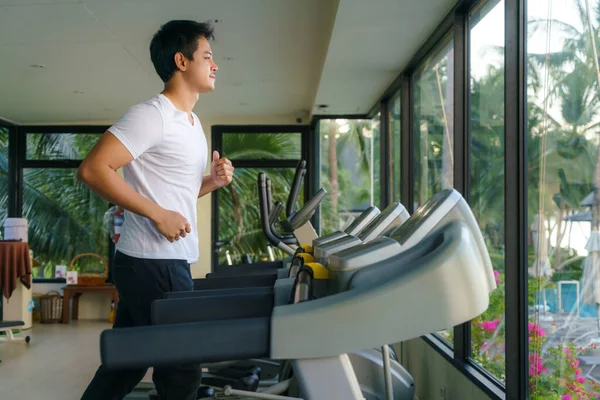 Asian Man Working Out Treadmill Resort Fitness Center Morning — стоковое фото