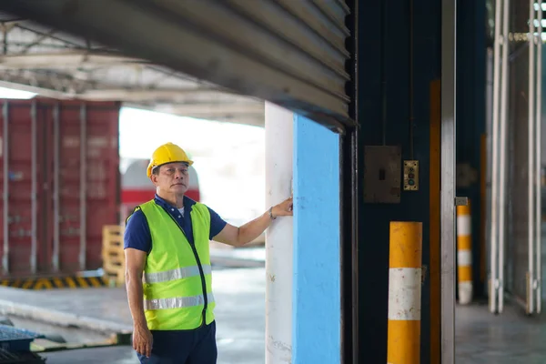Asian Warehouse Worker Coveralls Protective Helmet Opening Shutter Roller Door — Stock Photo, Image