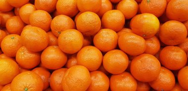 Arkaplan olarak taze mandalina portakalı veya mandalina