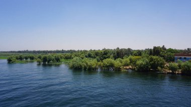 Landscape of the Nile river in Egypt seen from a boat