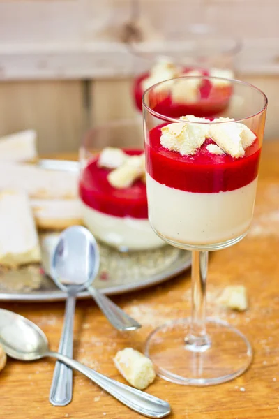 Vanilla white chocolate cream with raspberry puree (selective focus)