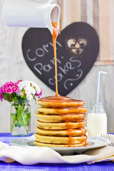 Corn pancakes with caramel sauce — Stock Photo, Image