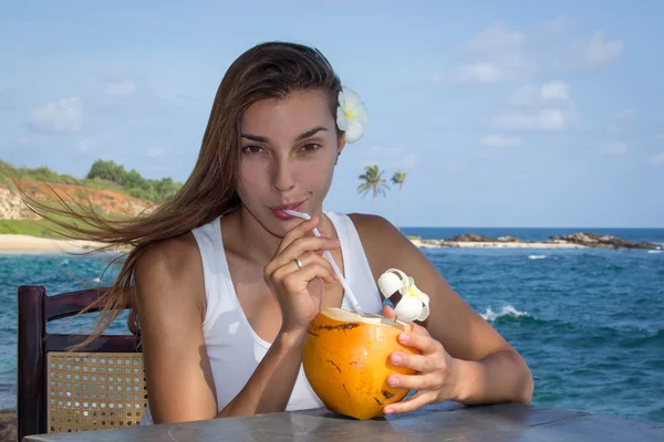 Girl with coconut cocktail — Stock Photo, Image