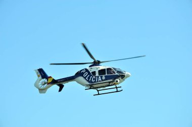 Gijon, Spain - July 24, 2022. Policia Nacional (Spanish Police) Eurocopter EC135 in full flight during Gijon International Air festival 2022.