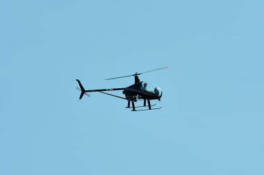 Gijon, Spain - July 24, 2022. Ultralight helicopter CH7 Kompress Charlie in full flight during Gijon International Air festival 2022.