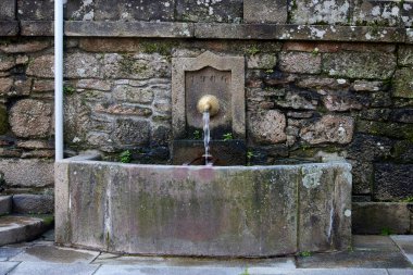 Stone fountain. It is dated 1966 