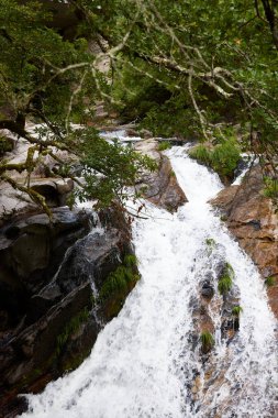 Waterfall and rocks of the Arado river, in the Gers Natural Park (Portugal)