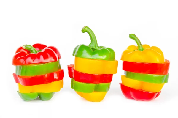 A selection of colorful bell peppers sliced in pieces to make on Stock Image