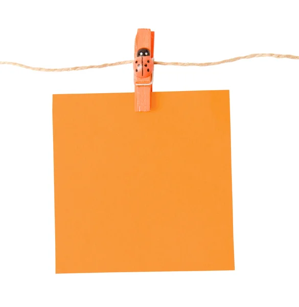 Pinned orange notepad isolated on white background — Stock Photo, Image