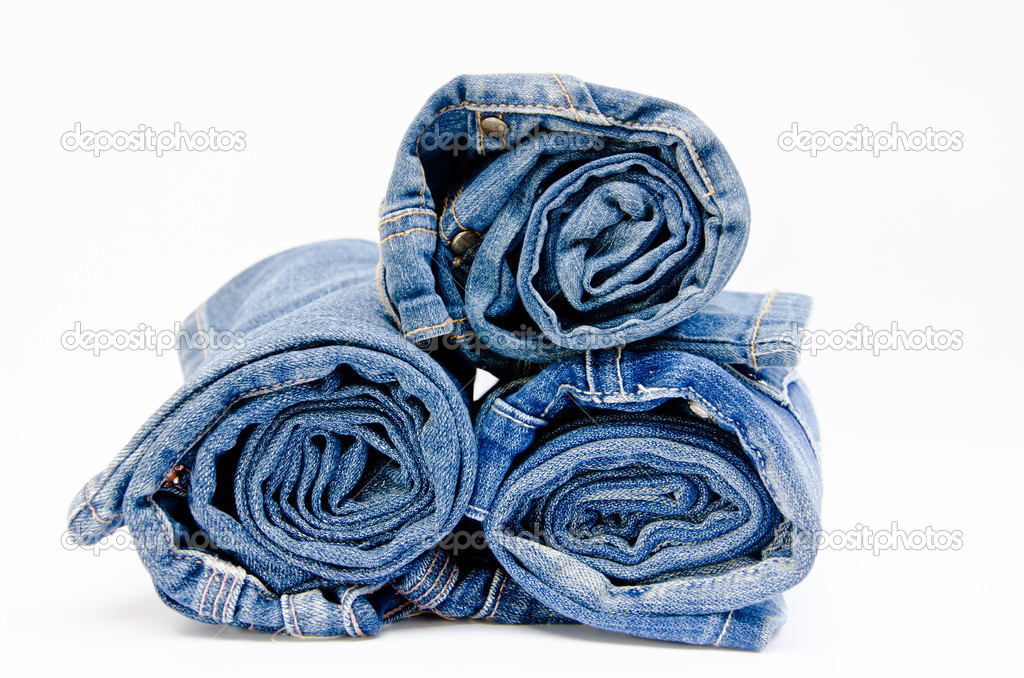 roll blue denim jeans arranged in stack