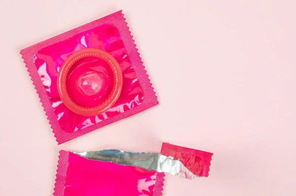 Pink Opened Condom Unpack Pink Background Safe Sex Reproductive Health — Stock Photo, Image