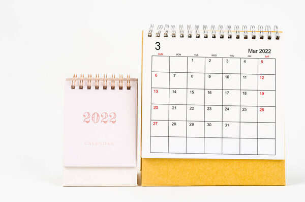 The March 2022 desk calendar on white background.
