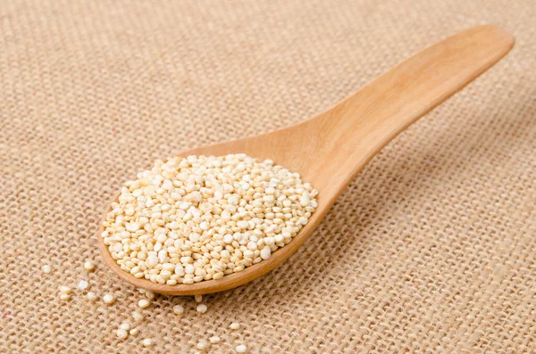 Raw Whole Unprocessed Quinoa Seed Wooden Spoon Sack Background — 图库照片