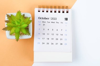 The October 2022 desk calendar with tree pot.