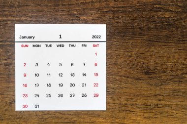 The January 2022 calendar on vintage wooden background. clipart