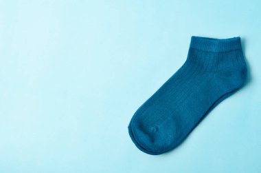 The Blue socks on blue background and space for text.