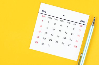 The May 2022 calendar on yellow background.