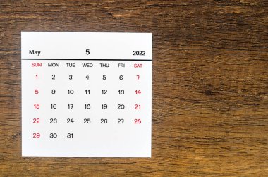 The May 2022 calendar on vintage wooden background. clipart