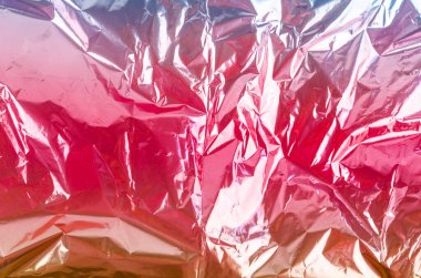 Parlak buruşuk yüzeyi olan renkli folyo arka plan doku arkaplanı