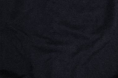 Siyah tuvalin koyu renk arkaplanının yakın plan görüntüsü.